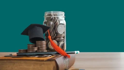 scholarship amount with graduation cap on a book