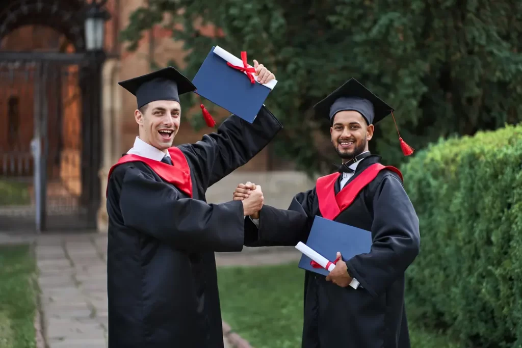 Two international celebrating the selection in graduation through University of Southamton scholarships.